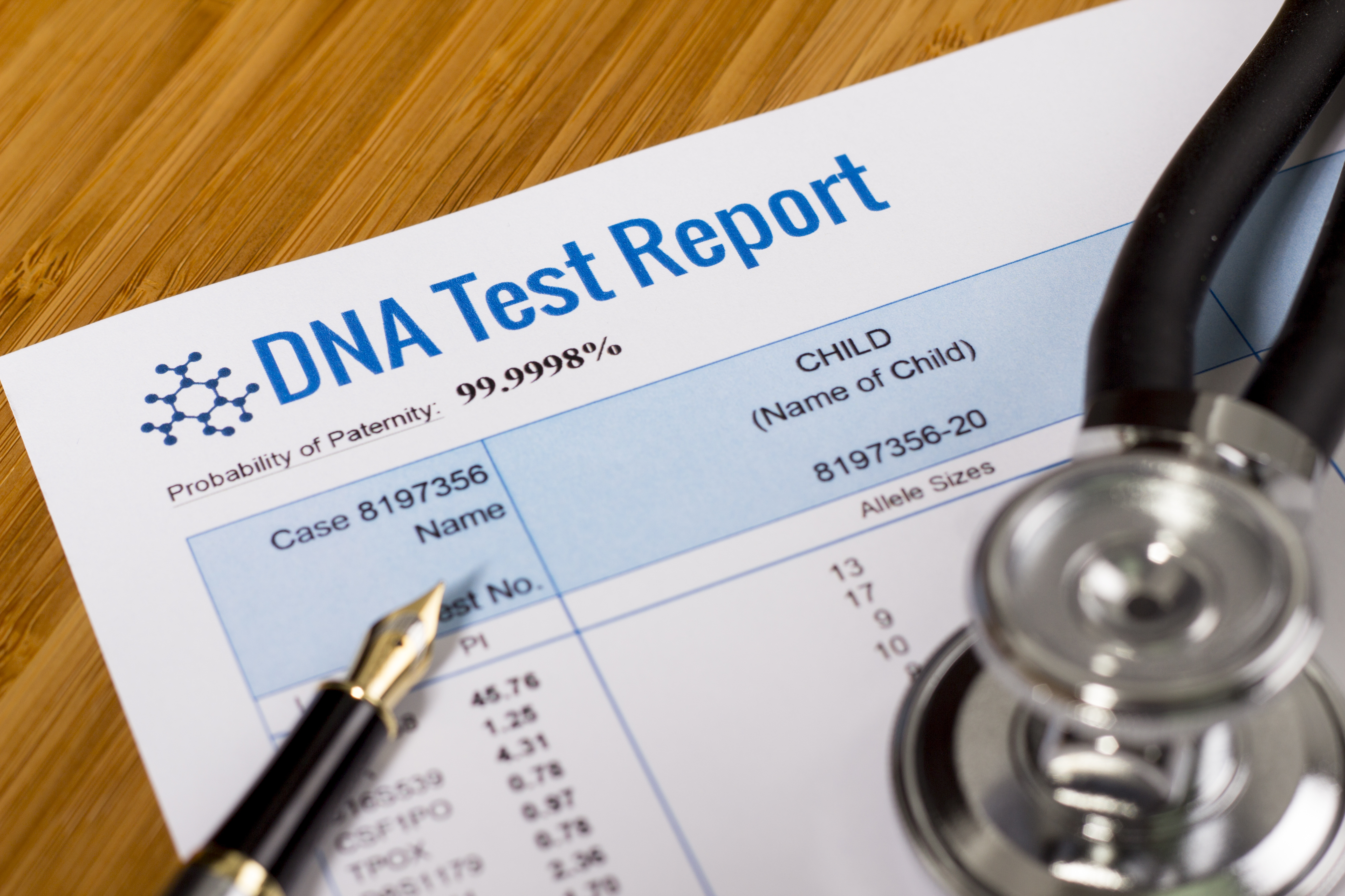 A DNA test report of paternity with a pen and stethoscope. | Source: Shutterstock