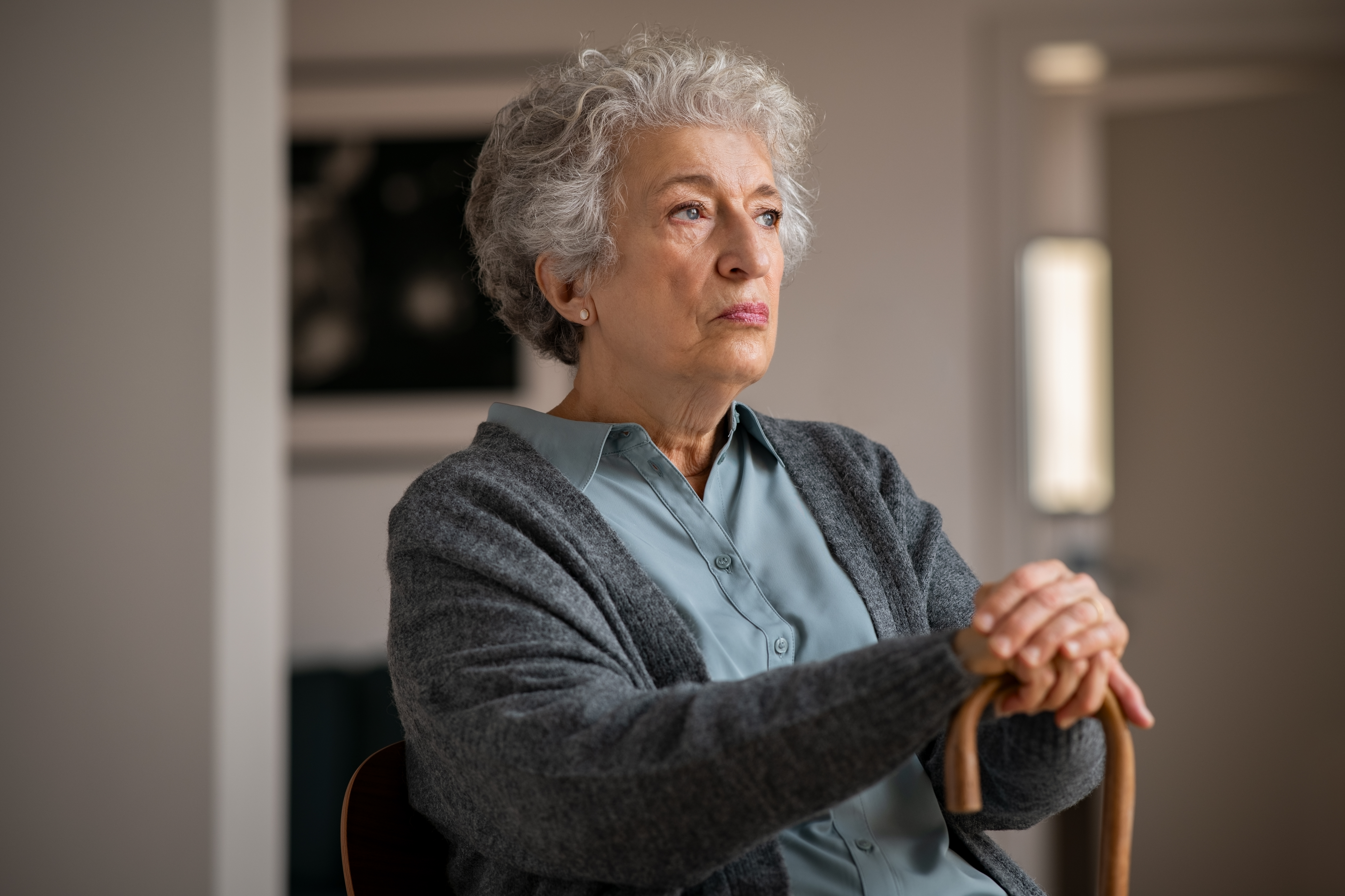 An elderly woman looking angry | Source: Shutterstock