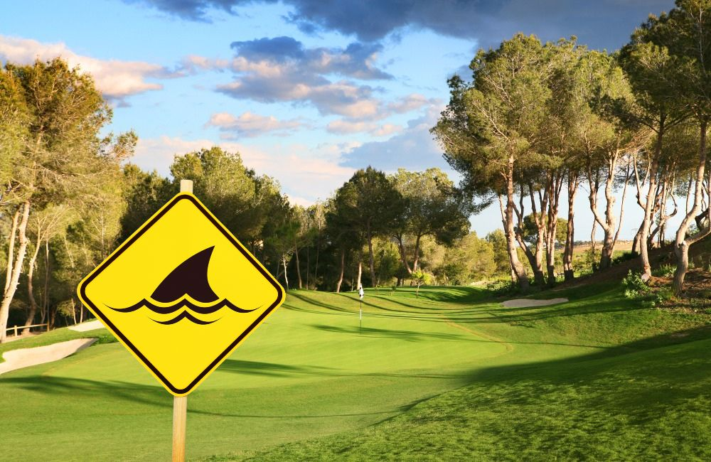 Shark fin sign on golf course