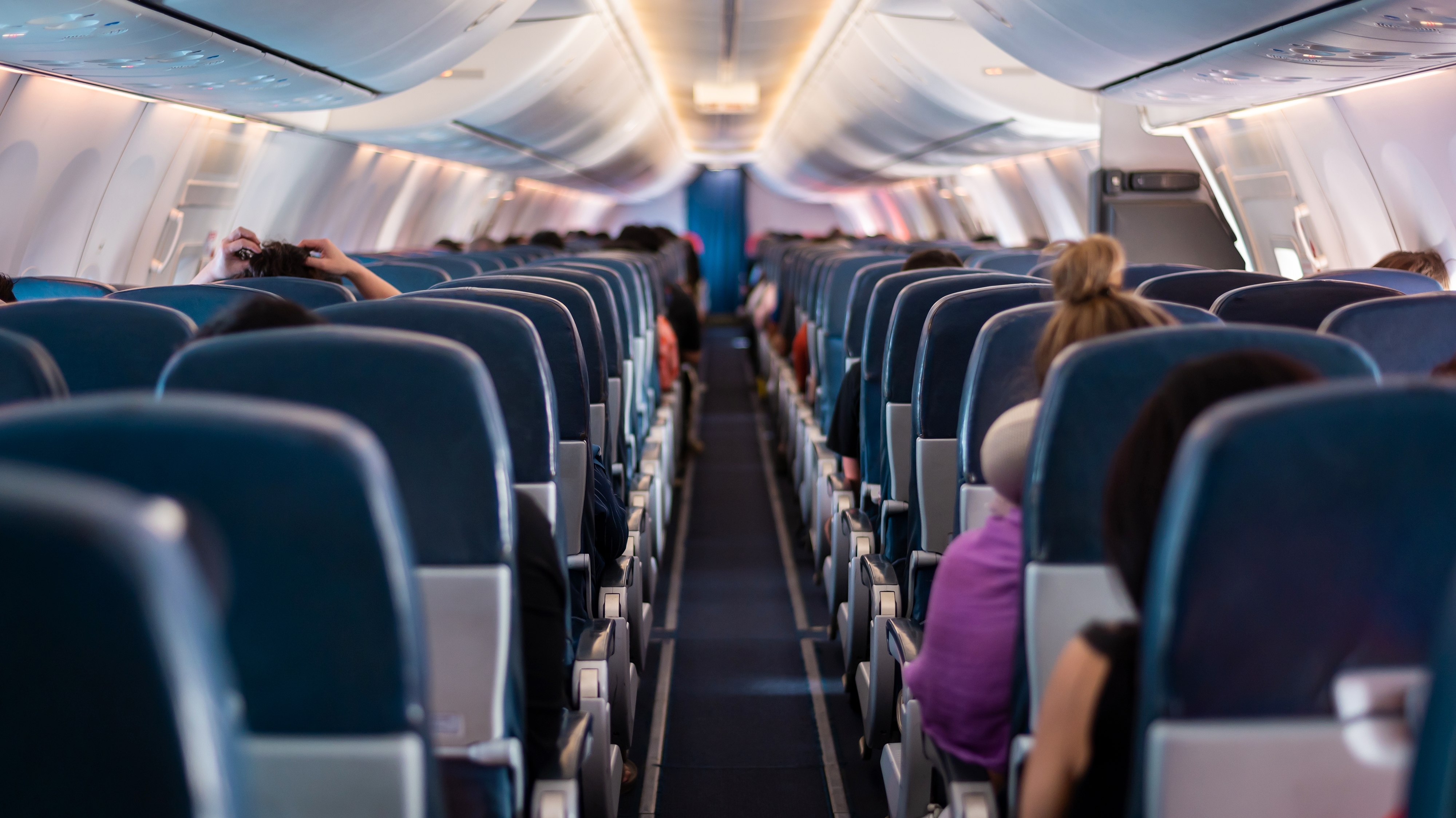 Matt had to stay in economy class while everyone else was in first class. | Source: Shutterstock