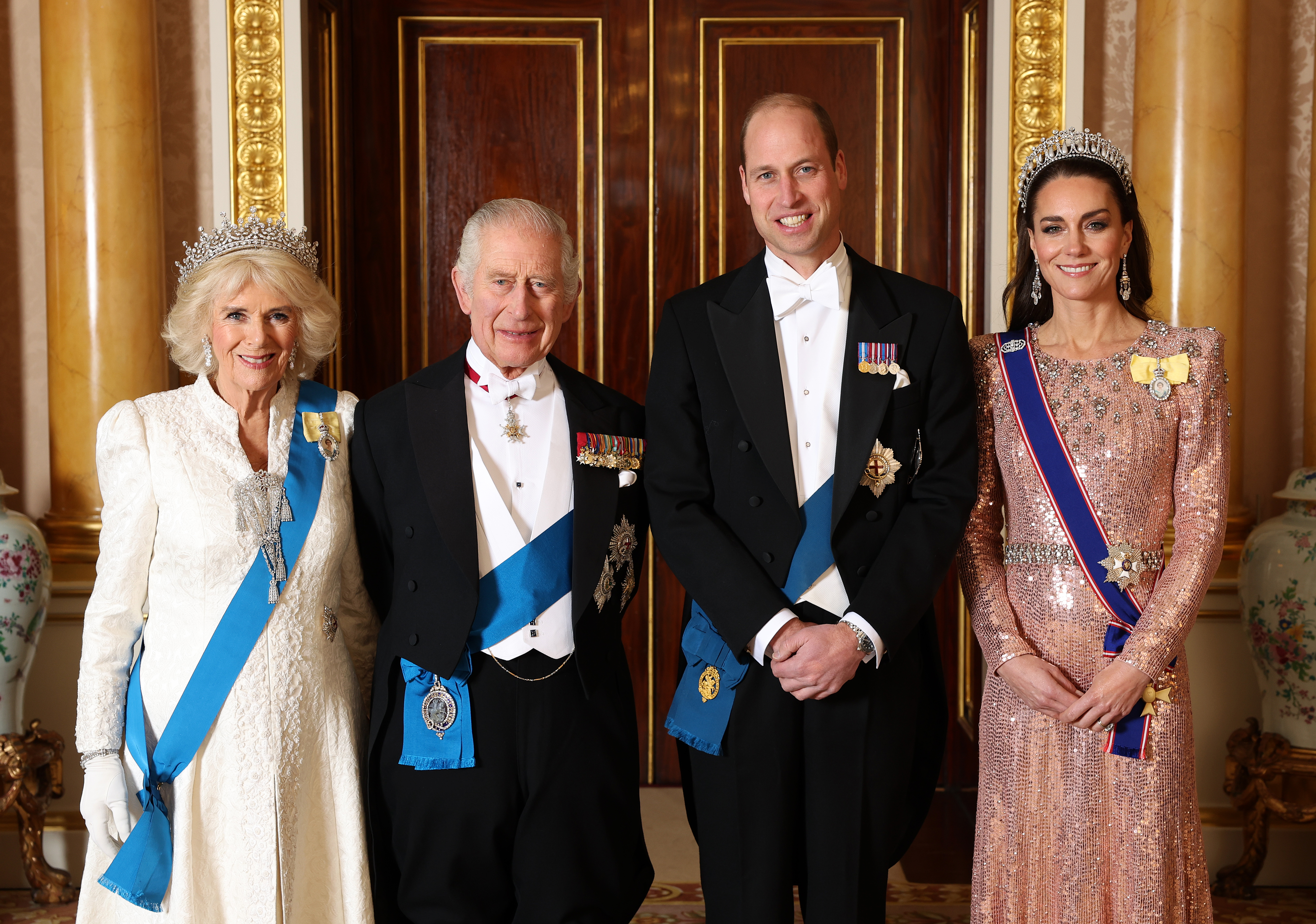 King Charles III, Queen Camilla, Prince William, and Princess Catherine before the  The Diplomatic Reception in the 1844 Room at Buckingham Palace on December 05, 2023 in London, England | Source: Getty Images